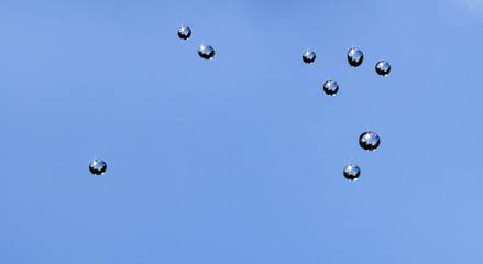 Close-up of water drops on glass surface as background