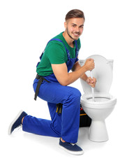 Young man working with toilet bowl, isolated on white