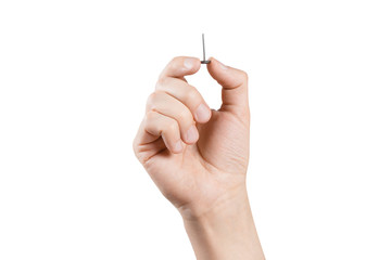 Hand holding a small pin, isolated on white background