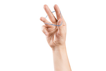 Hand playing with elastic hair band on white background