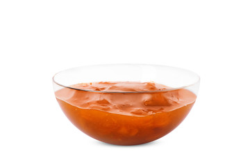 Bowl with tasty apricot jam on white background