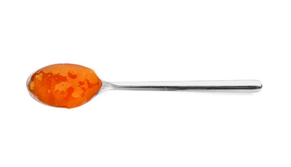 Spoon with tasty apricot jam on white background, top view