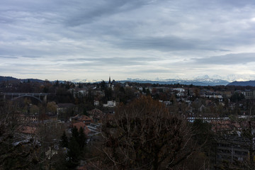 city of bern with snow mountain alps in background