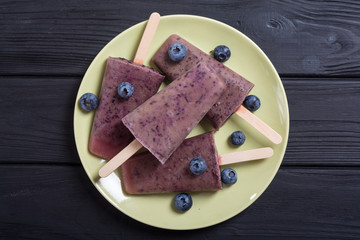 Popsicle with blueberries and yogurt