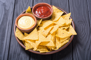 Crispy chips nachos with tomato and cheese sauce