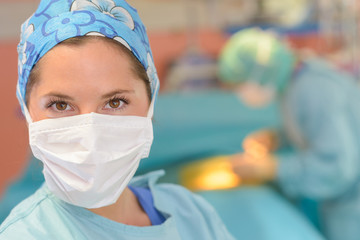 portrait of surgeon wearing surgical mask in operation room