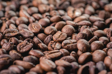 Close up of coffee beans are the background.