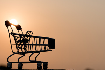close up of Cart on keyboard computer with tablet background (Online shopping)