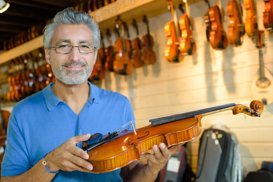 man holding a violin
