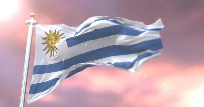 Flag of Uruguay waving at wind in slow at sunset, loop