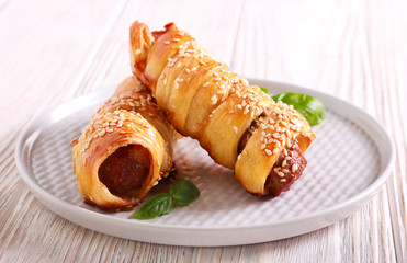 Sausage rolls with sesame on top