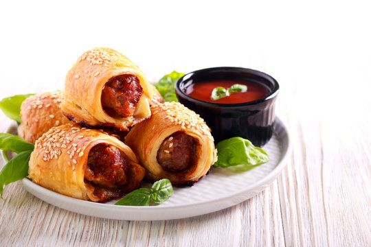 Mini Sausage Rolls With Sesame On Top,