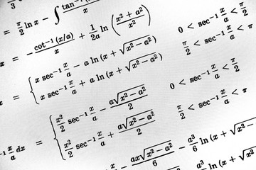 Large number of mathematical formulas on a white background