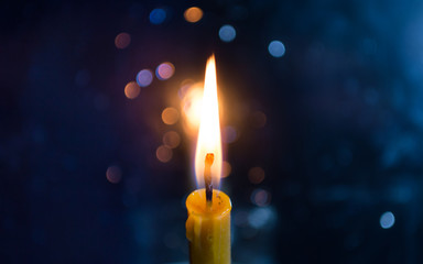 Burning Candle with Bokeh Background