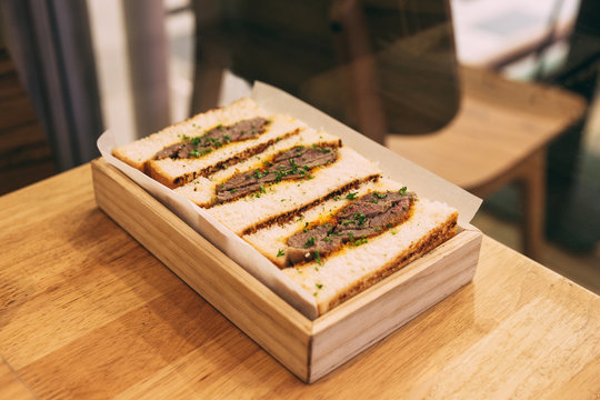 Japanese Medium Rare Wagyu Sandwich Served In Wooden Box.