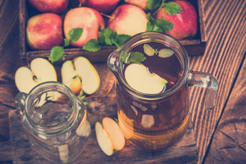 Jug with freshly made pressed apple juice