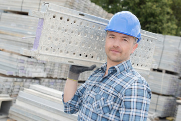 Man carrying metal platform