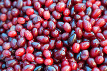 Cornelian cherries  for sale at a farmer's market.