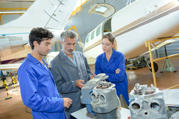 aviation engineers and apprentices - obrazy, fototapety, plakaty