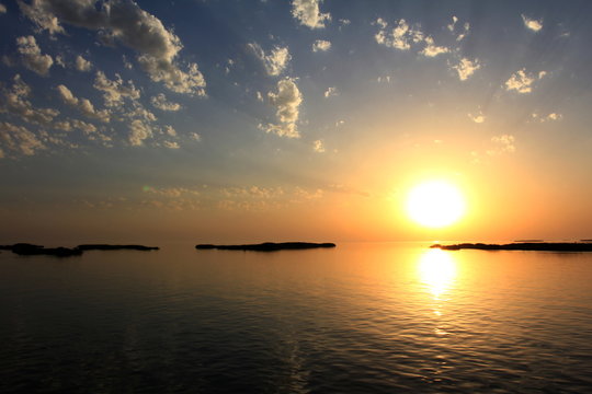 boundless sea, gold water, gold sunset