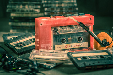 Antique audio cassette with walkman and headphones