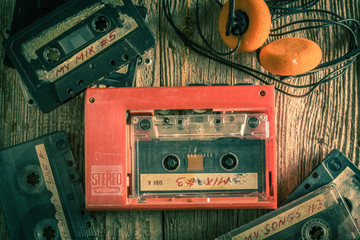 Retro audio cassette with walkman and headphones - obrazy, fototapety, plakaty