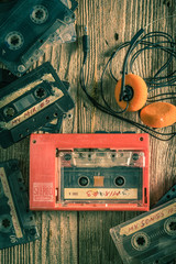 Vintage audio cassette with headphones and walkman