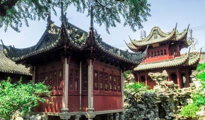 Red temple, traditional chinese buildings and rocks at Yu Gardens, Shanghai, China