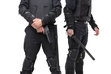 Police with a gun and a baton on white background
