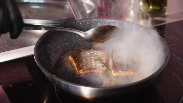 Pan-fried fish, Two pieces of loban fillet on the steaming frying pan.