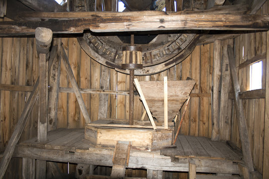 old wooden mill. The internal mechanism of how the windmill works.