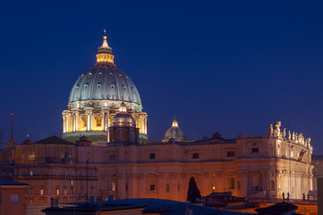 Saint Peter Basilica lit at night in the Vatican, Rome, Italy.