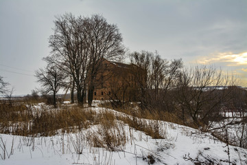 Ruined old mill on the river bank.