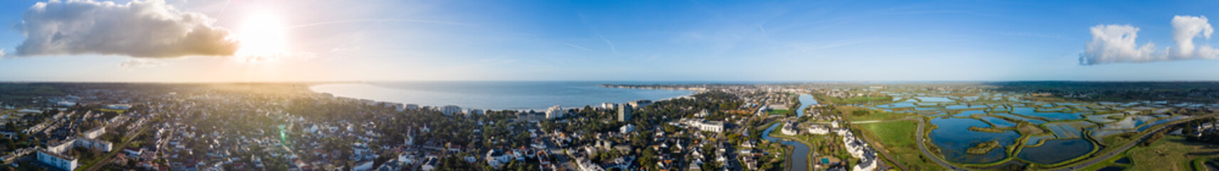 Drone panorama of La Baule Escoublac with seaside, beach and salt marshes.
