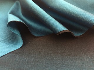 Woven texture of silk fabric or yarn turquois beige color changeable for background. Advertising...