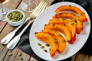 Rosemary honey roasted pumpkin wedges with pumpkin seeds