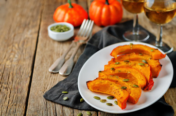Rosemary honey roasted pumpkin wedges with pumpkin seeds