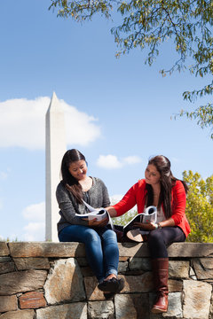 Young Women Studying Together in Washington, DC with Washington Monument in the Background
