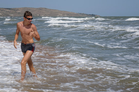 young swimmer on a summer beach