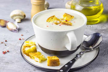mushroom cream soup on white wooden board. top view