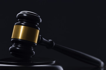 Wooden hammer on black background