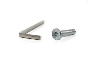 Isolated Allen screw driver wrench with a screw on white background