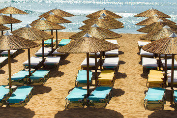 Sunbeds and umbrellas on a sandy beach, Falassarna, Crete