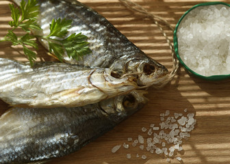  On them falls a striped shadow from the straw louver.