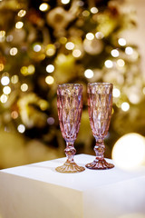 Beautiful champagne glasses on a festive background