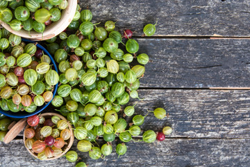 Fresh gooseberries on wooden 