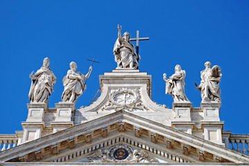 Fototapeta na wymiar Detail shot showing statues atop St. John Lateran church, Rome