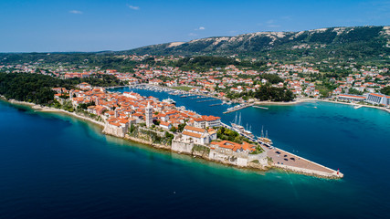 Fototapeta na wymiar Rab is a Croatian island in the Adriatic Sea, old town encircled by ancient walls. The town’s 4 prominent church bell towers include the Romanesque tower at the Cathedral Svete Marije (St. Mary)