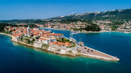 Foto op Canvas Rab is a Croatian island in the Adriatic Sea, old town encircled by ancient walls. The town’s 4 prominent church bell towers include the Romanesque tower at the Cathedral Svete Marije (St. Mary) © Nikola