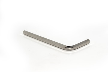 Single isolated Allen screw driver wrench made from stainless steel on white background